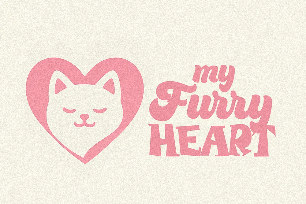 A pink logo featuring a heart-shaped outline with a cat’s face inside, next to the text “My Furry Heart” in a rounded, playful font on a soft cream background.